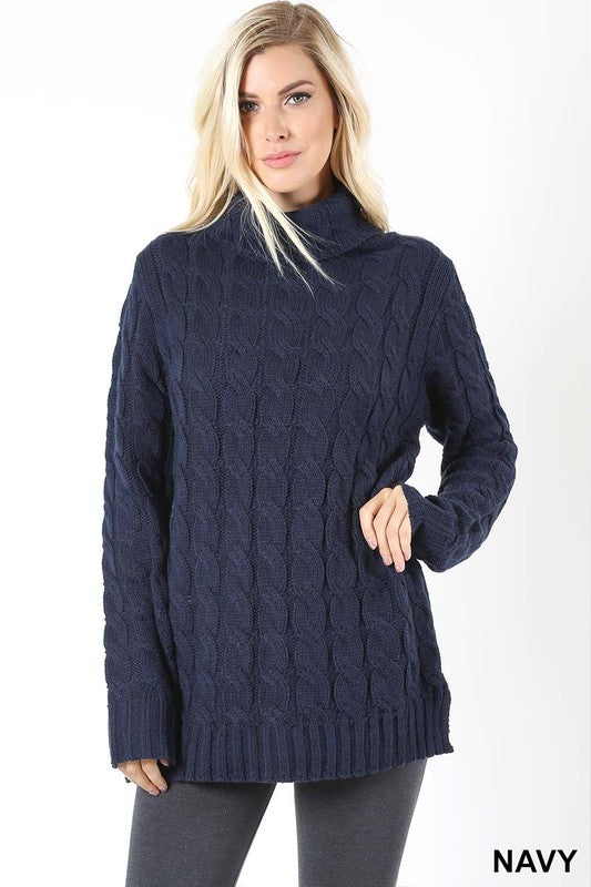 navy cable knit sweater with a cowl neckline
